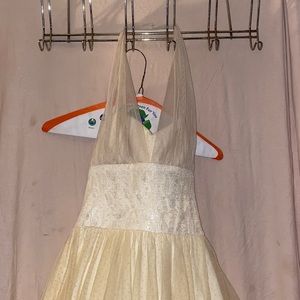 Cream colored mini dress size 1/2, goes up around the neck no tie